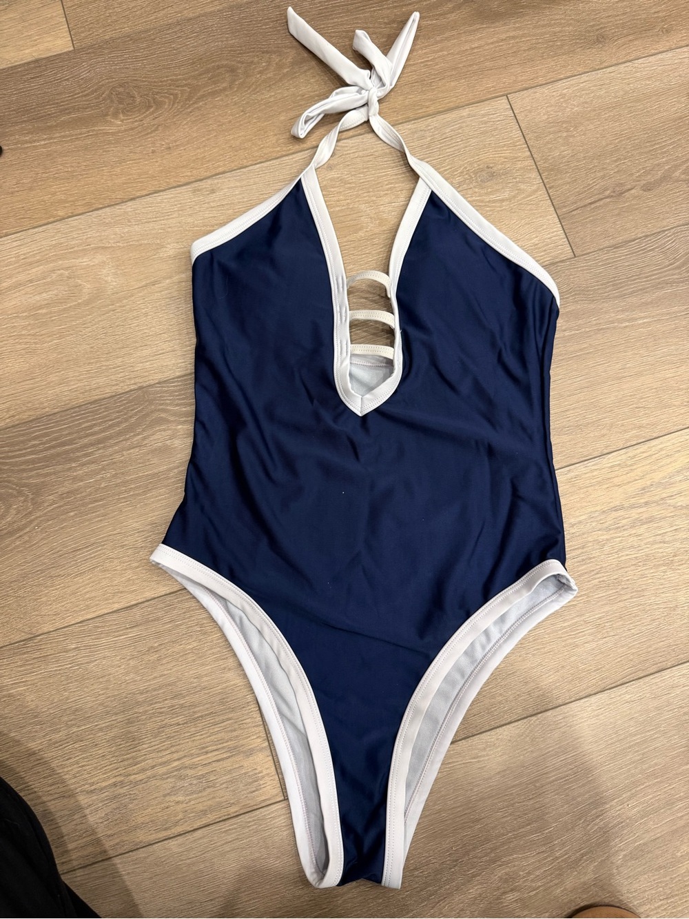 Flattering Navy One-Piece Halter Swimsuit with White Trim
